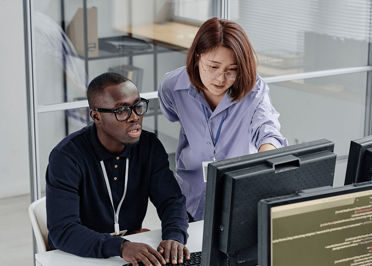 two professionals working on cybersecurity
